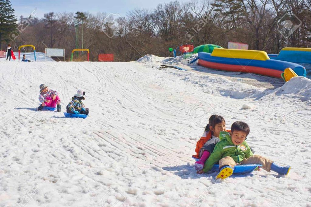 43352043 karuizawa japan 30 march 2015 kids having fun on the ski slopes karuizawa is one of the few ski 1