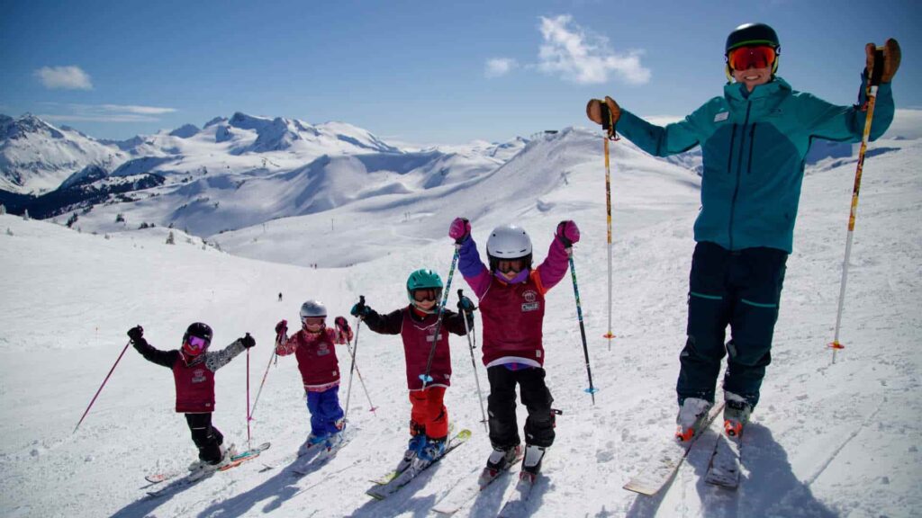 Prj Can Whistler instructor group outstretched 1